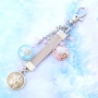 Bracelets and keychains with pendants and cabochons of real flowers and shells