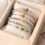 Colourful bracelets of faceted beads with golden details