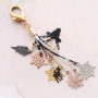 Bracelets and a keychain with bohemian pendants 