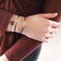 Bracelets and a keychain with bohemian pendants 