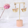 Bracelets and earrings with botanical colours and golden details