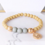 Bracelets and earrings with botanical colours and golden details