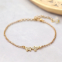 Trendy earrings and bracelets with zirconia charms and connectors: