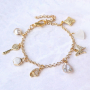 Trendy earrings and bracelets with zirconia charms and connectors: