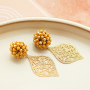 Get creative with stainless steel charms for statement earrings