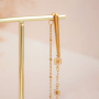 Get creative with stainless steel charms for statement earrings