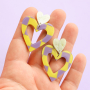 Create stylish earrings with resin pendants and stainless steel charms