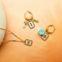 Create a unique collection with stainless steel shell charms with letters