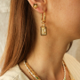 Create a unique collection with stainless steel shell charms with letters
