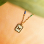 Create a unique collection with stainless steel shell charms with letters