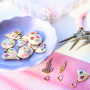 Create a funky charm necklace with metal charms with enamel