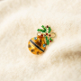 Mix & match with statement brooches