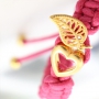 Fashionably bracelets made of waxed cord with different items of Designer Quality metal