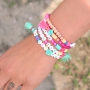 Create joyfull bracelets with bright coloured alphabet letterbeads